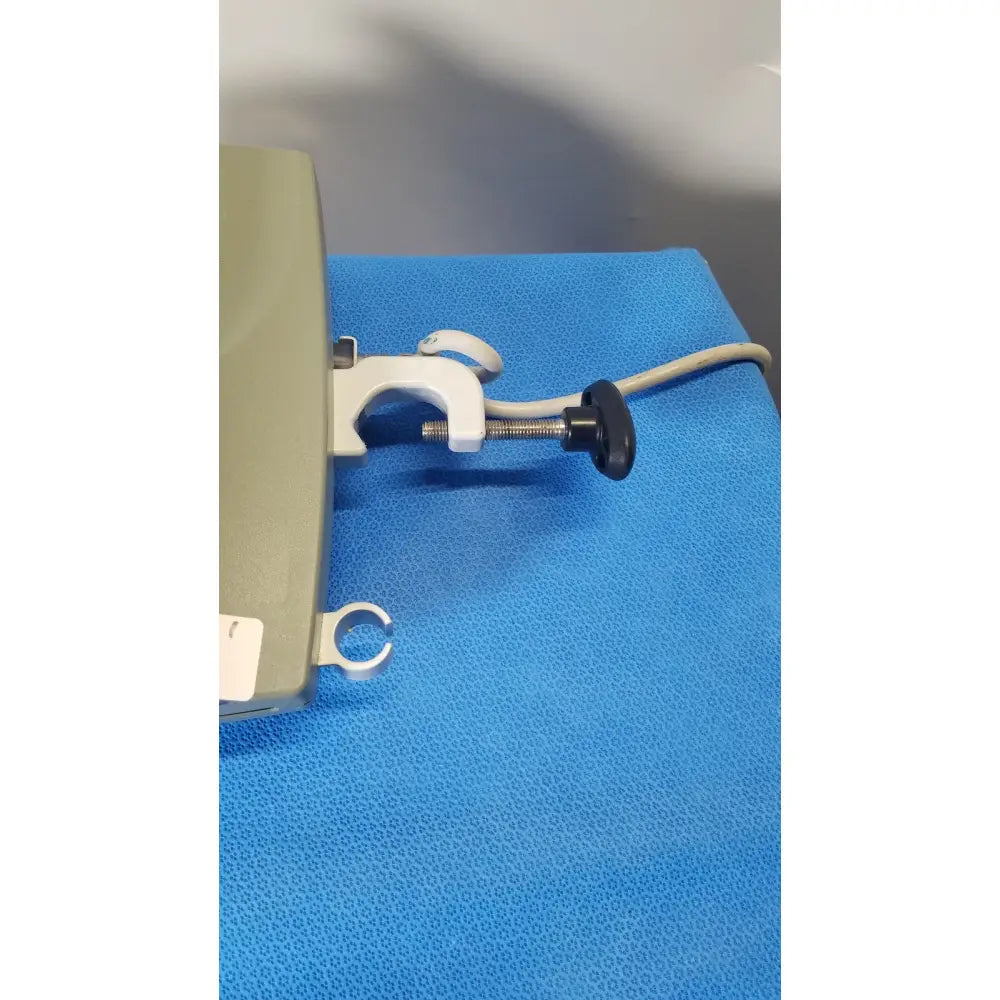 Beige arizant healthcare ranger fluid warming system with white clamp and black adjustment knob model 245