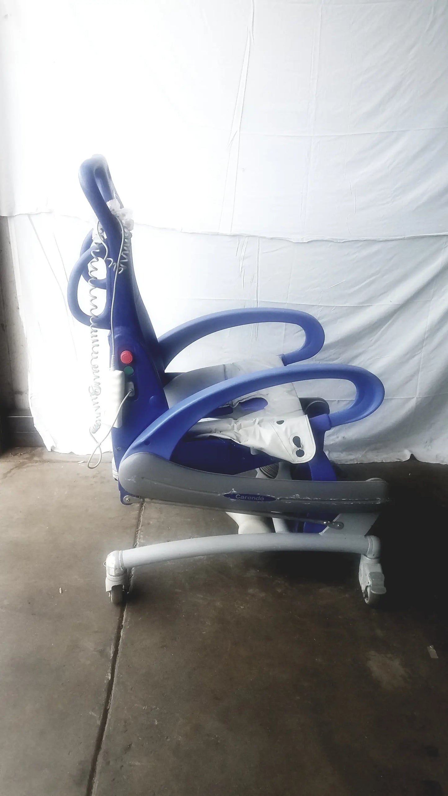 Arjo Carendo multipurpose hygiene chair blue and gray adjustable pediatric chair with curved armrests and wheels