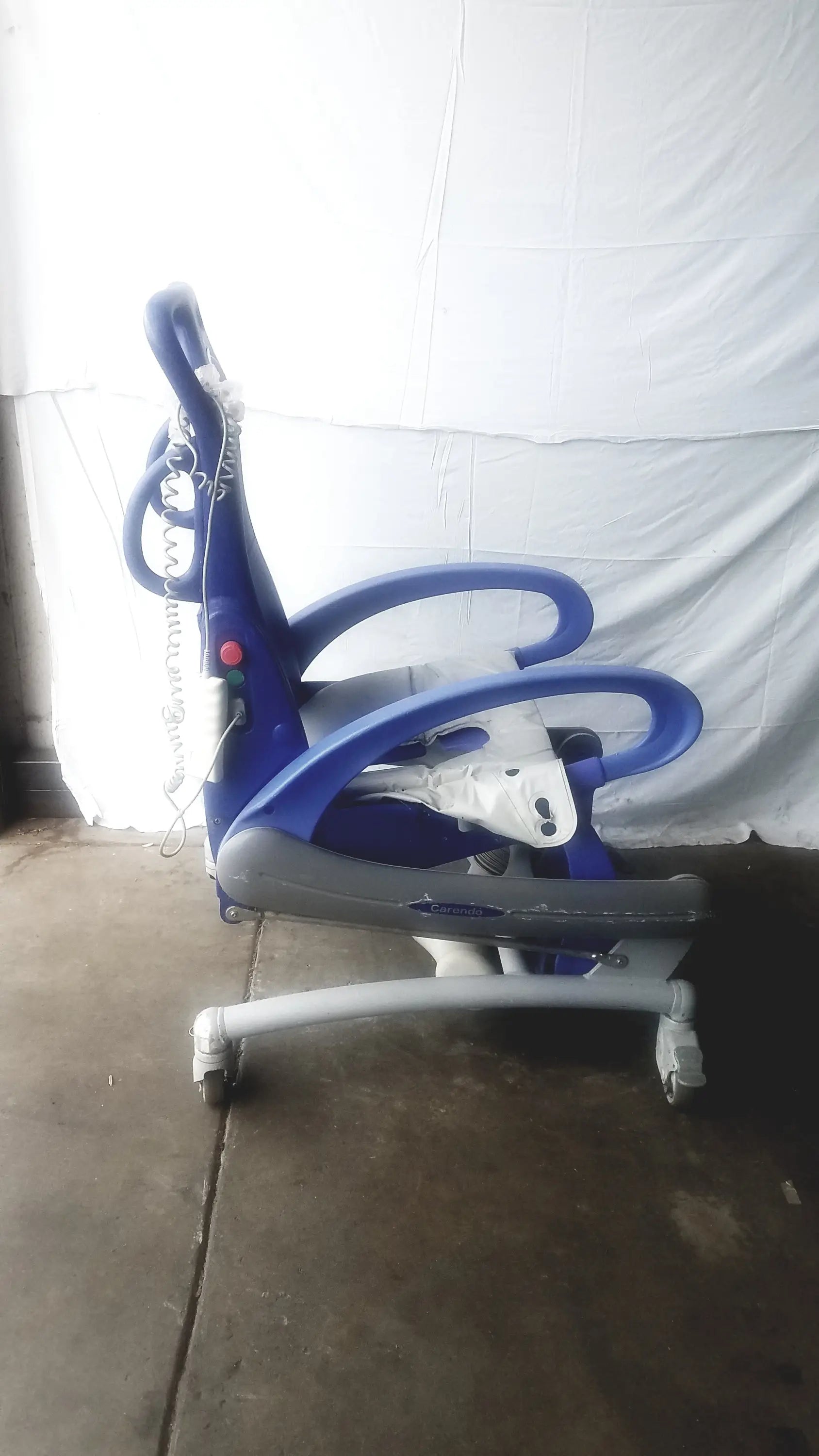 Arjo Carendo multipurpose hygiene chair blue and gray adjustable pediatric chair with curved armrests and wheels