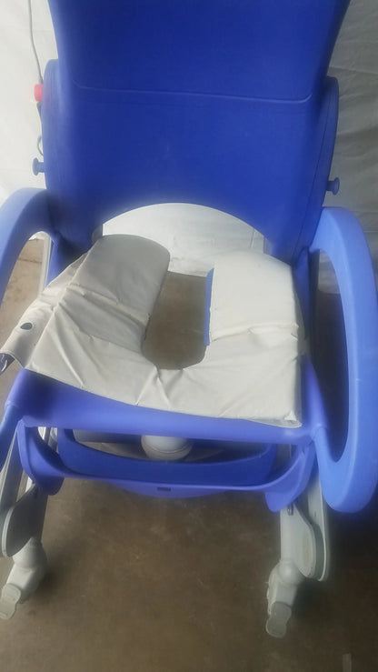 Blue plastic arjo carendo multipurpose hygiene chair with white cushion and absorbent pad for medical use