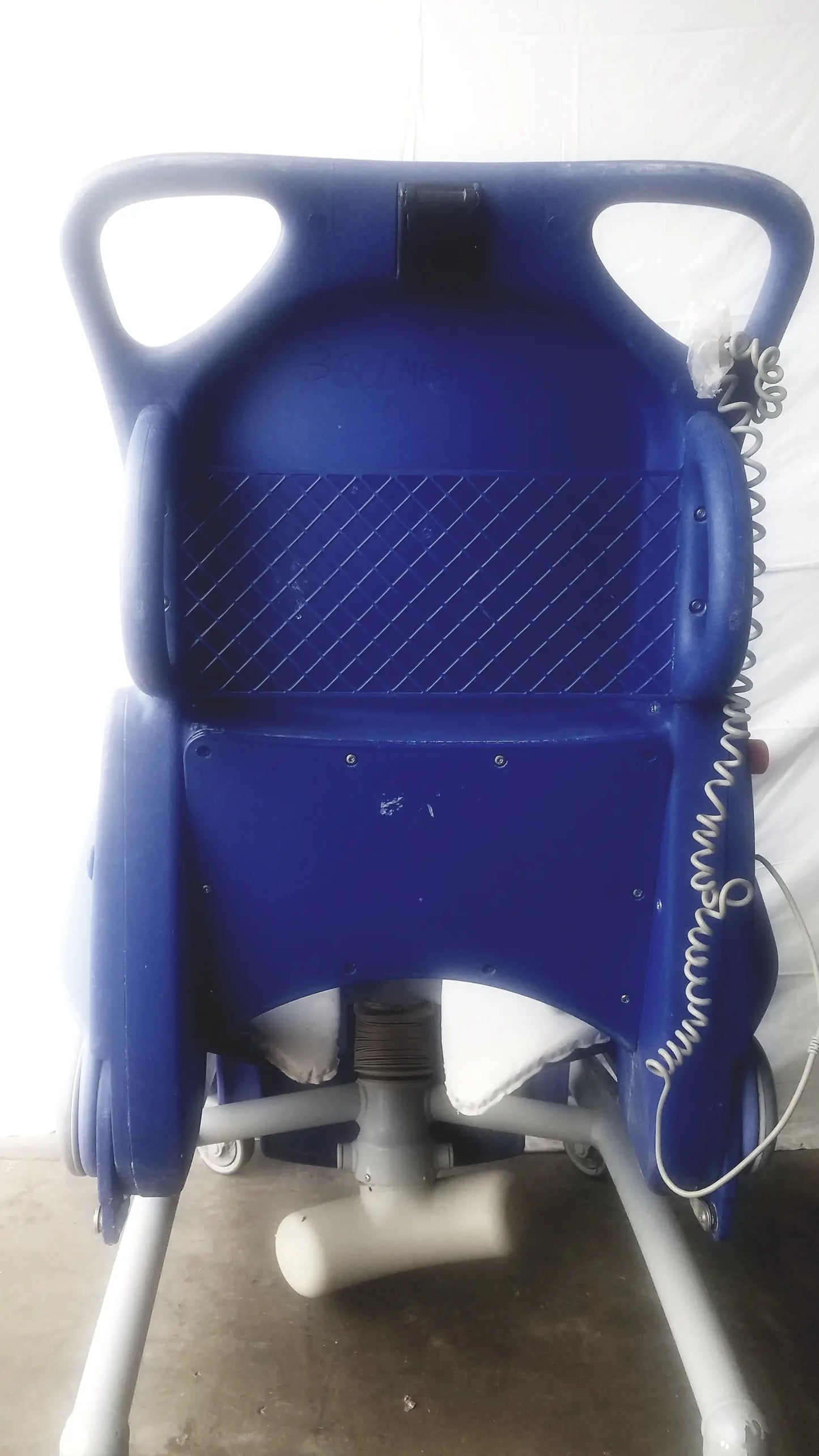 Blue plastic arjo carendo multipurpose hygiene chair with padded backrest and side handles for comfort and support