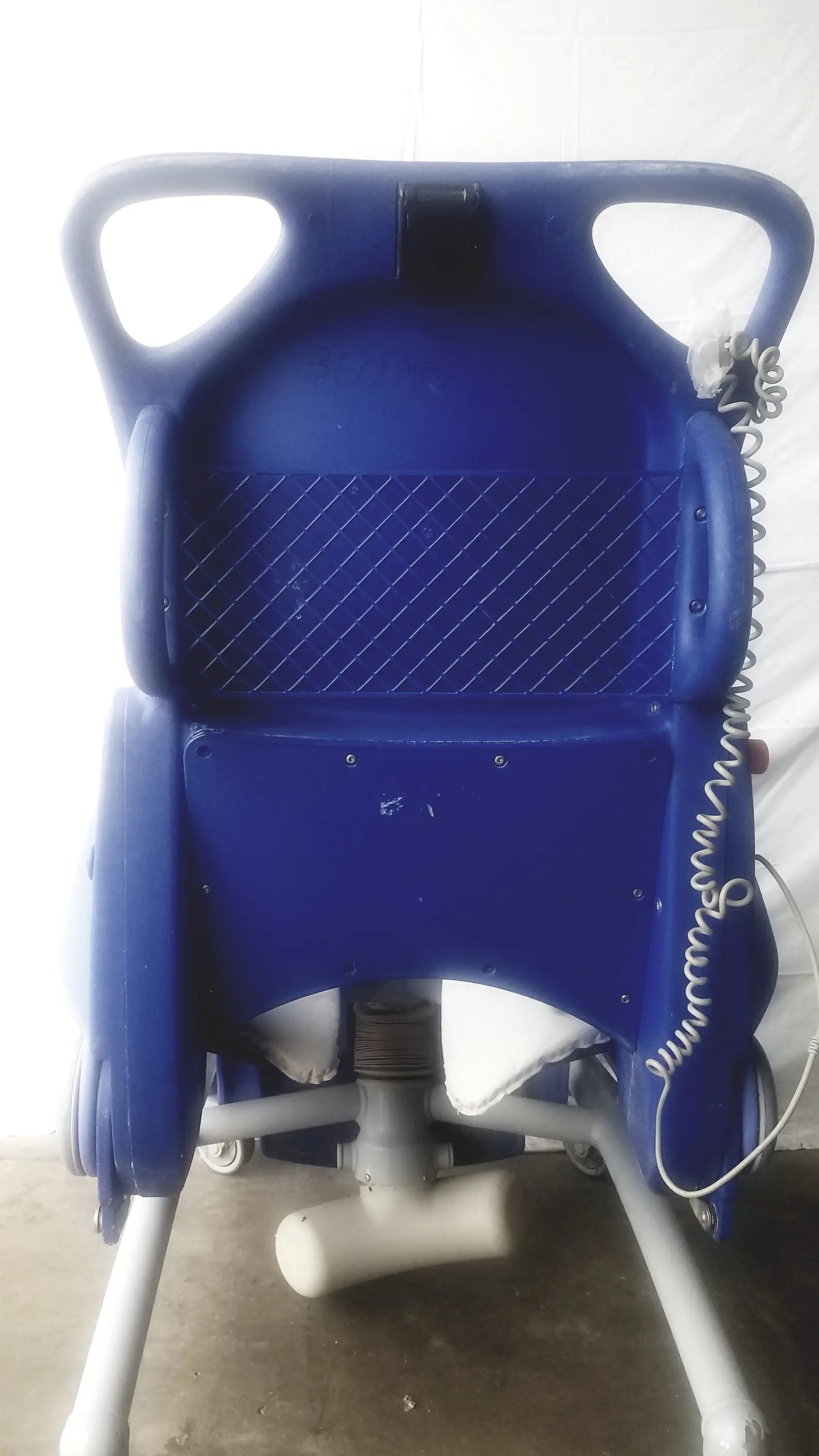 Blue plastic arjo carendo multipurpose hygiene chair with padded backrest and side handles for comfort and support