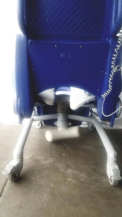 Blue plastic arjo carendo multipurpose hygiene chair with white wheels and coiled cable for efficient hygiene use