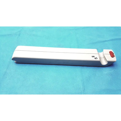 White plastic surgical instrument with red button and engraved markings for arjo huntleigh ab lead acid battery use