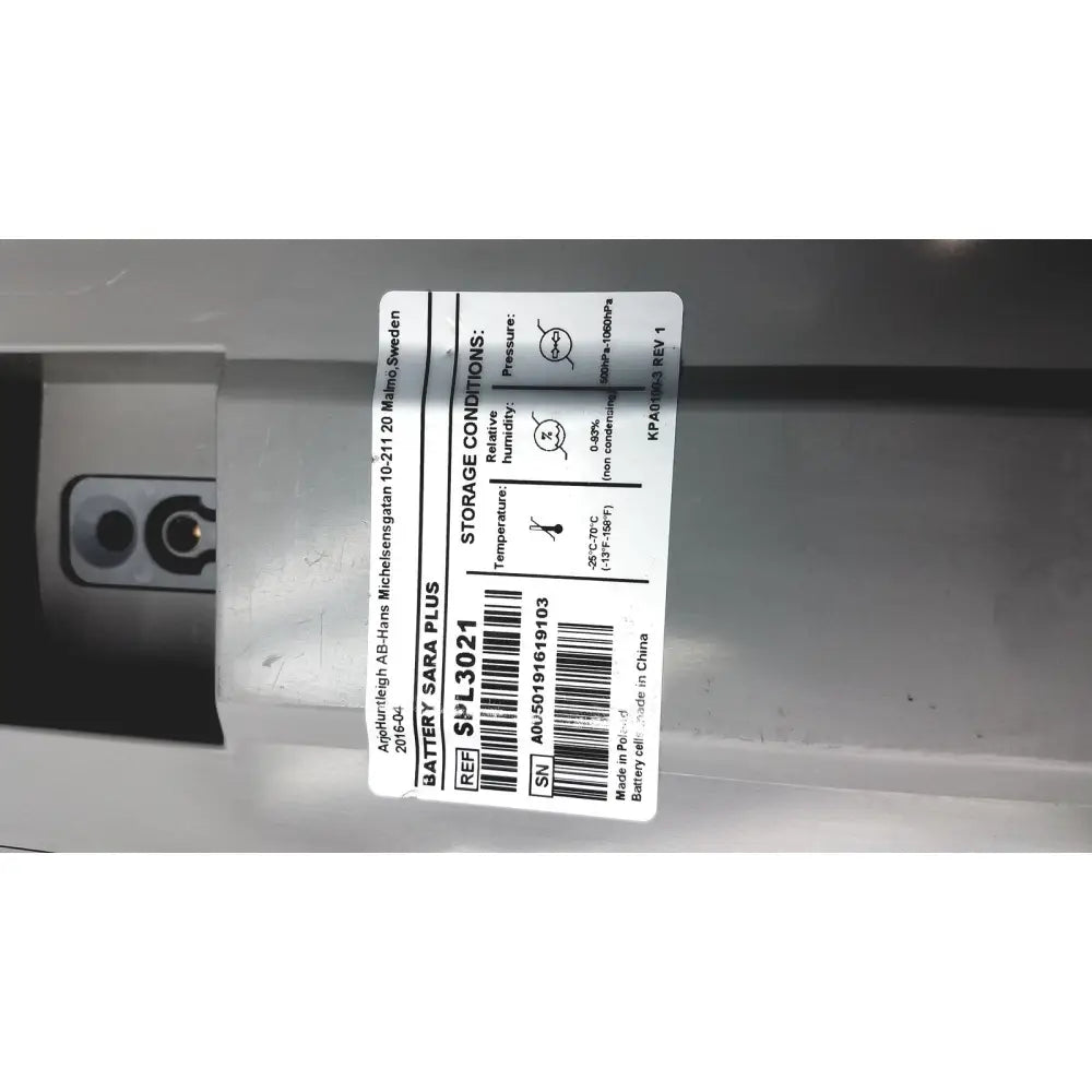 White rectangular label with black text and barcode on arjo huntleigh ab lead acid battery model sara plus by asea-brown boveri