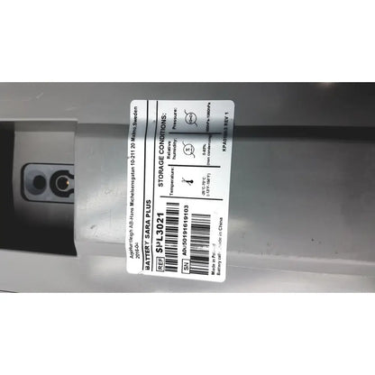 White rectangular label with black text and barcode on arjo huntleigh ab lead acid battery model sara plus by asea-brown boveri