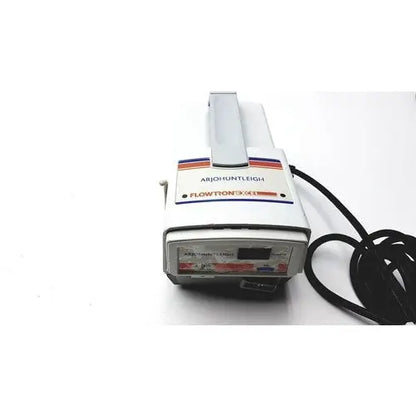 White plastic arjo huntleigh flowtron handheld uv light device with gray handle and black power cord model ac 550 fx1109362