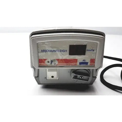 Arjo huntleigh flowtron excel medical infusion pump with gray plastic casing, digital display, and black power cord