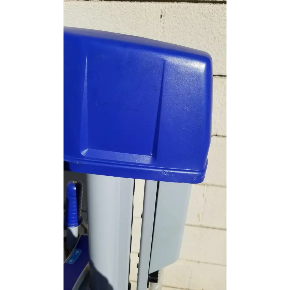 Blue plastic lid with textured surface and angular design for arjo huntleigh power electric walker ambulatory support