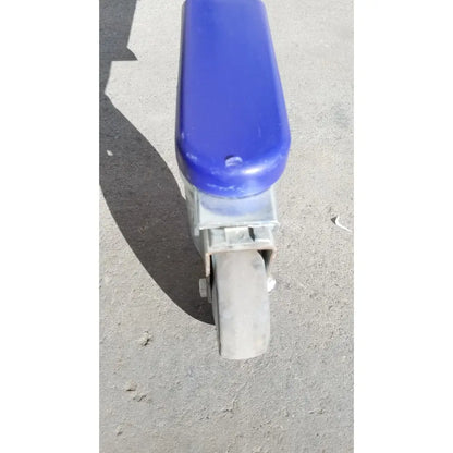 Blue plastic handle attached to metal caster wheel on arjo huntleigh power electric walker lift ambulatory support