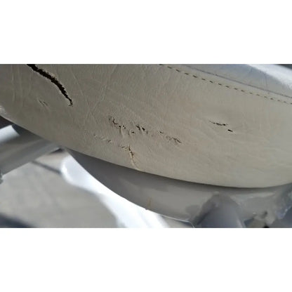 Beige leather car seat with visible wear and stitching on arjo huntleigh power electric walker lift ambulatory support