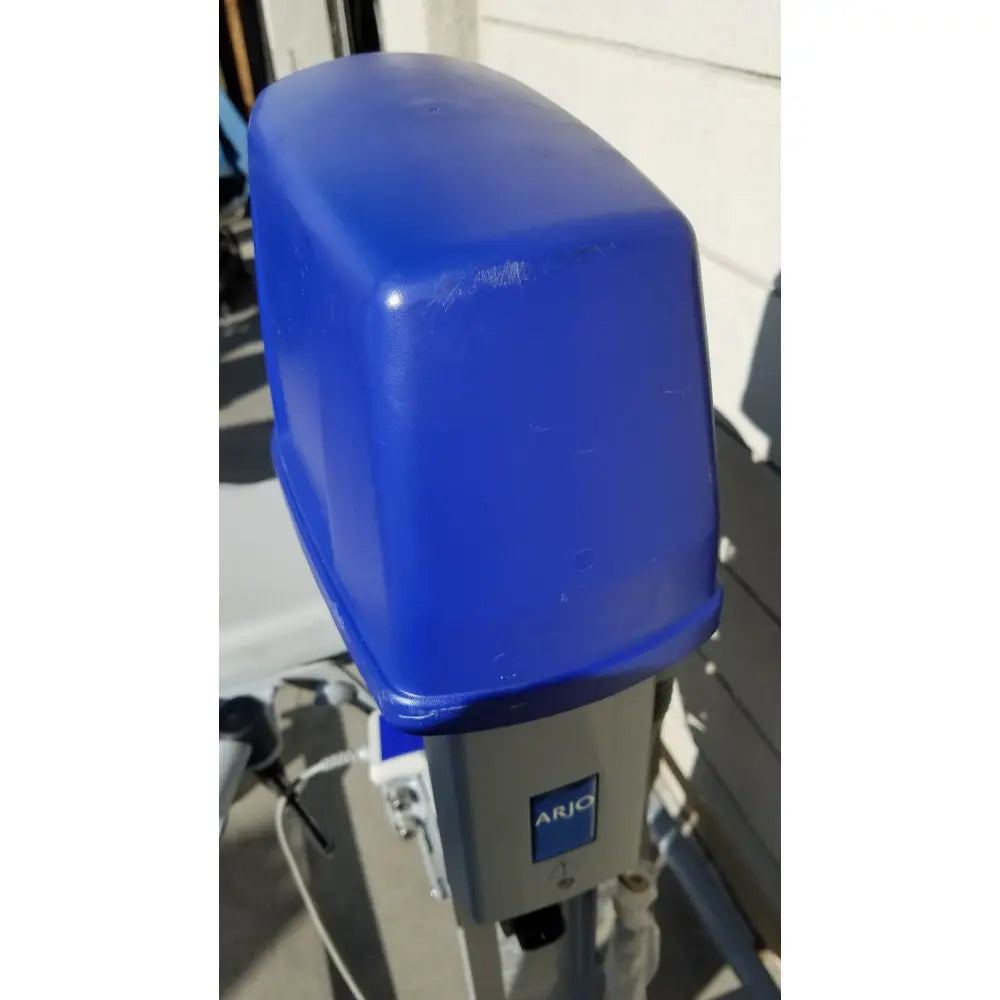 Blue plastic cover on the arjo huntleigh power electric walker lift for ambulatory support medical use
