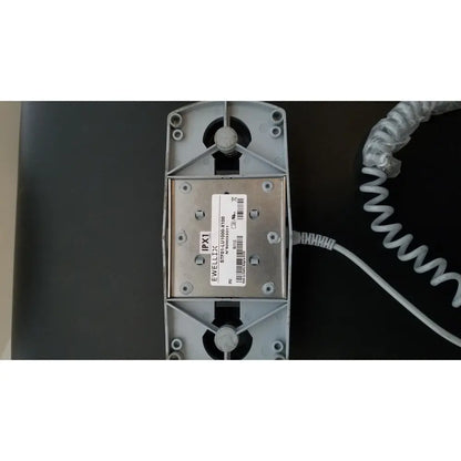 Gray plastic housing with metallic plate and vents on the back side of armedica am-300 three section treatment table
