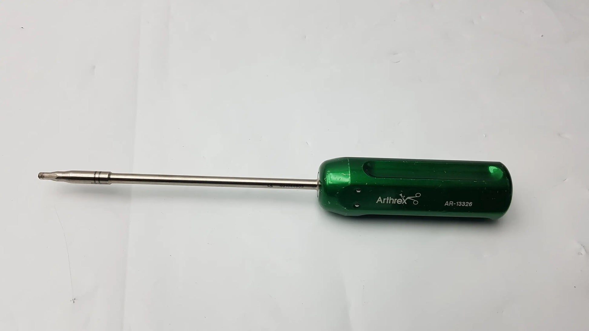 Arthrex AR-13326 green cannulated screwdriver with ergonomic handle and metallic shaft precision surgical instrument