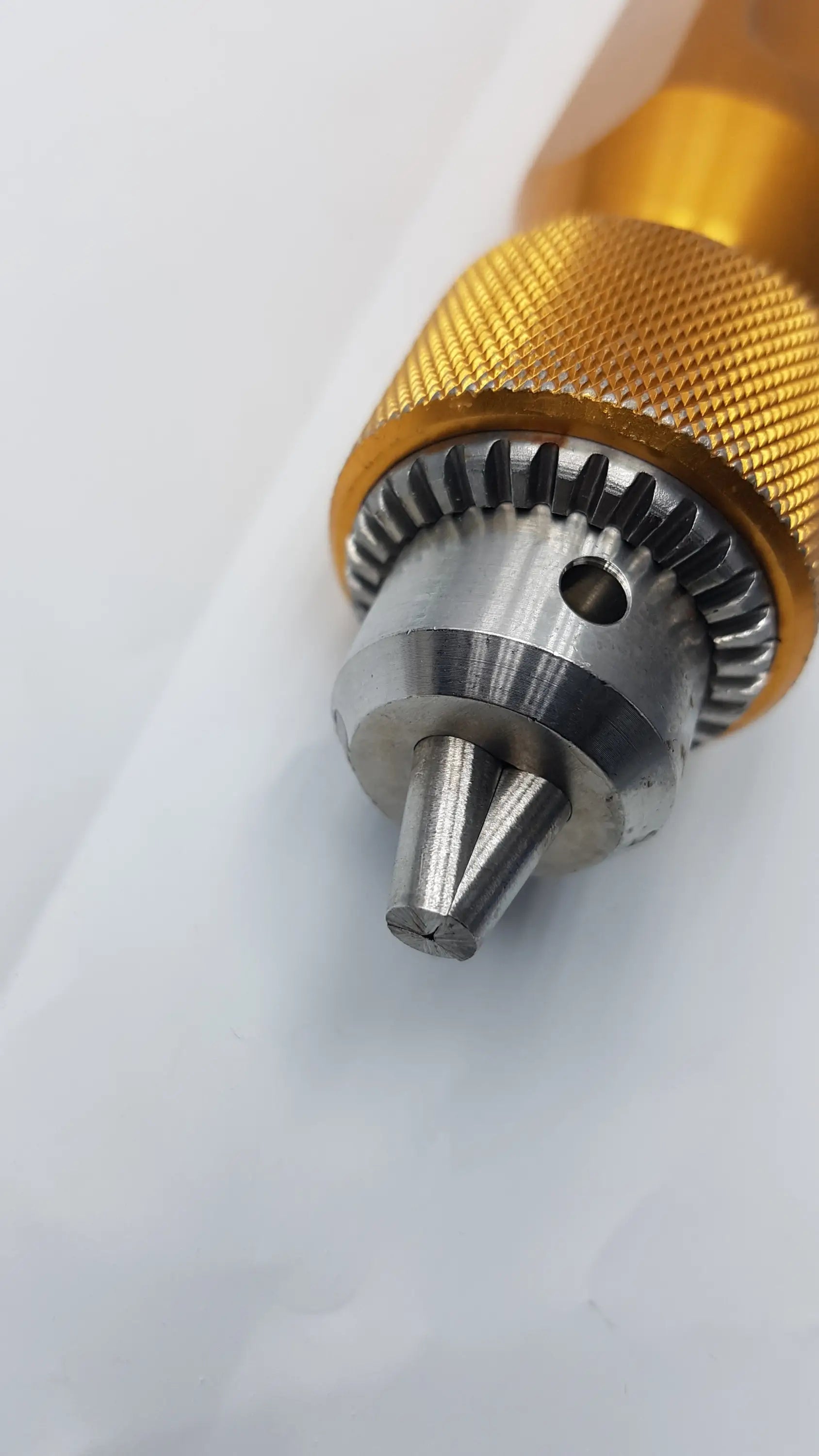Gold-colored metal Arthrex AR-1415 tube driver extractor with textured grip and silver-toned internal gear mechanism