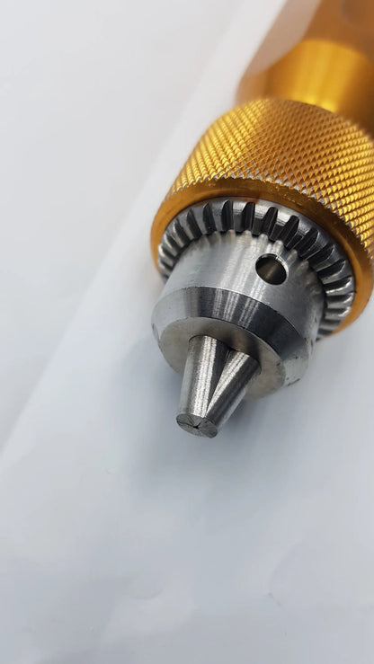 Gold-colored metal Arthrex AR-1415 tube driver extractor with textured grip and silver-toned internal gear mechanism