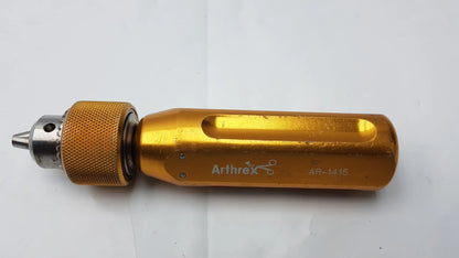 Gold-colored arthrex ar-1415 surgical orthopedic tube driver extractor with textured grip and metallic chuck for precise use