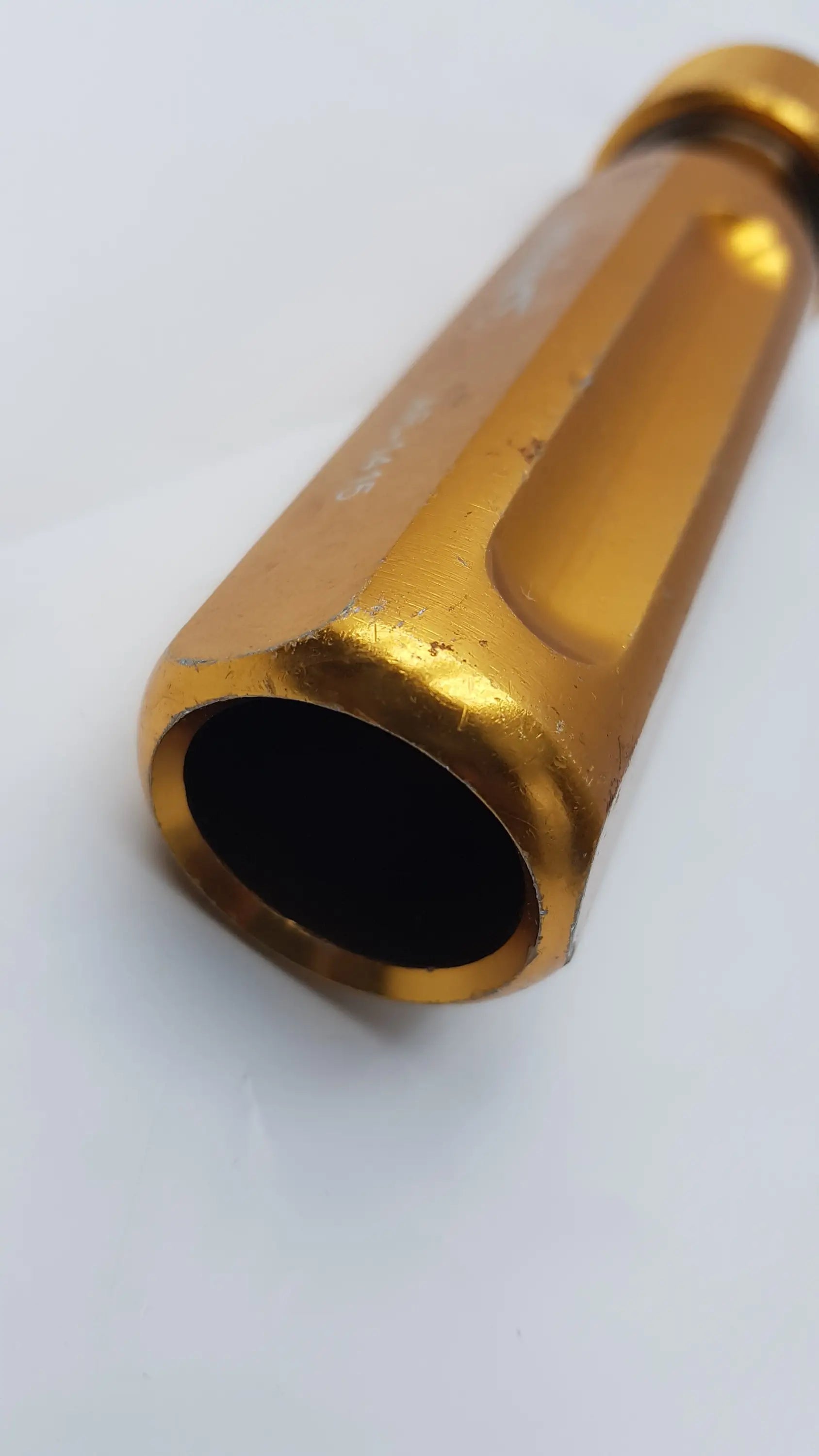 Arthrex ar-1415 golden hexagonal metal surgical tube driver extractor with polished finish and visible machining grooves
