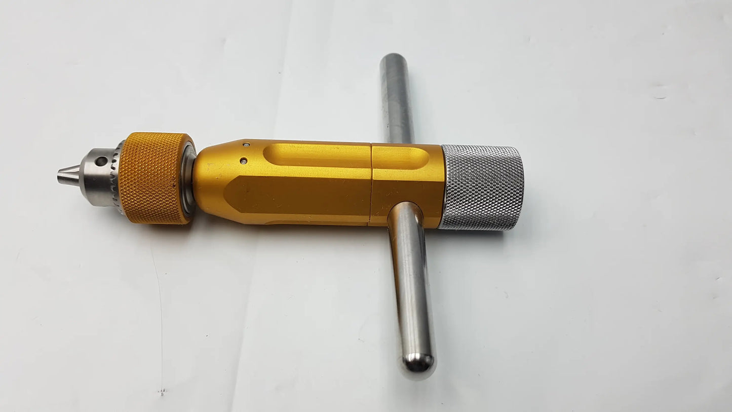 Gold-colored metal arthrex ar-1415t tube harvester driver extractor with textured grip oats chuck handle