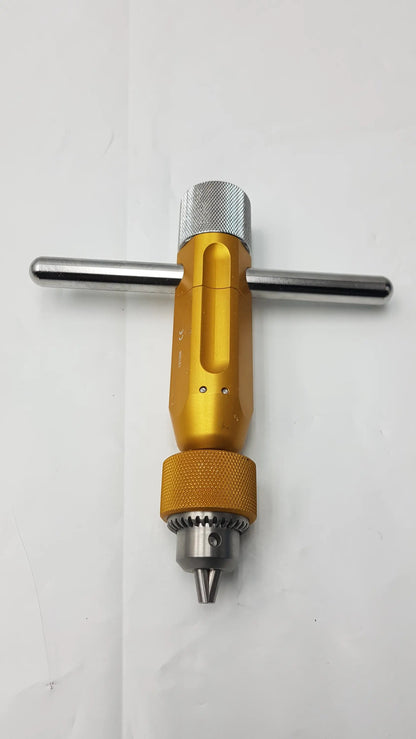 Gold-colored arthrex ar-1415t tube harvester driver extractor with textured oats chuck handle and silver metallic accents