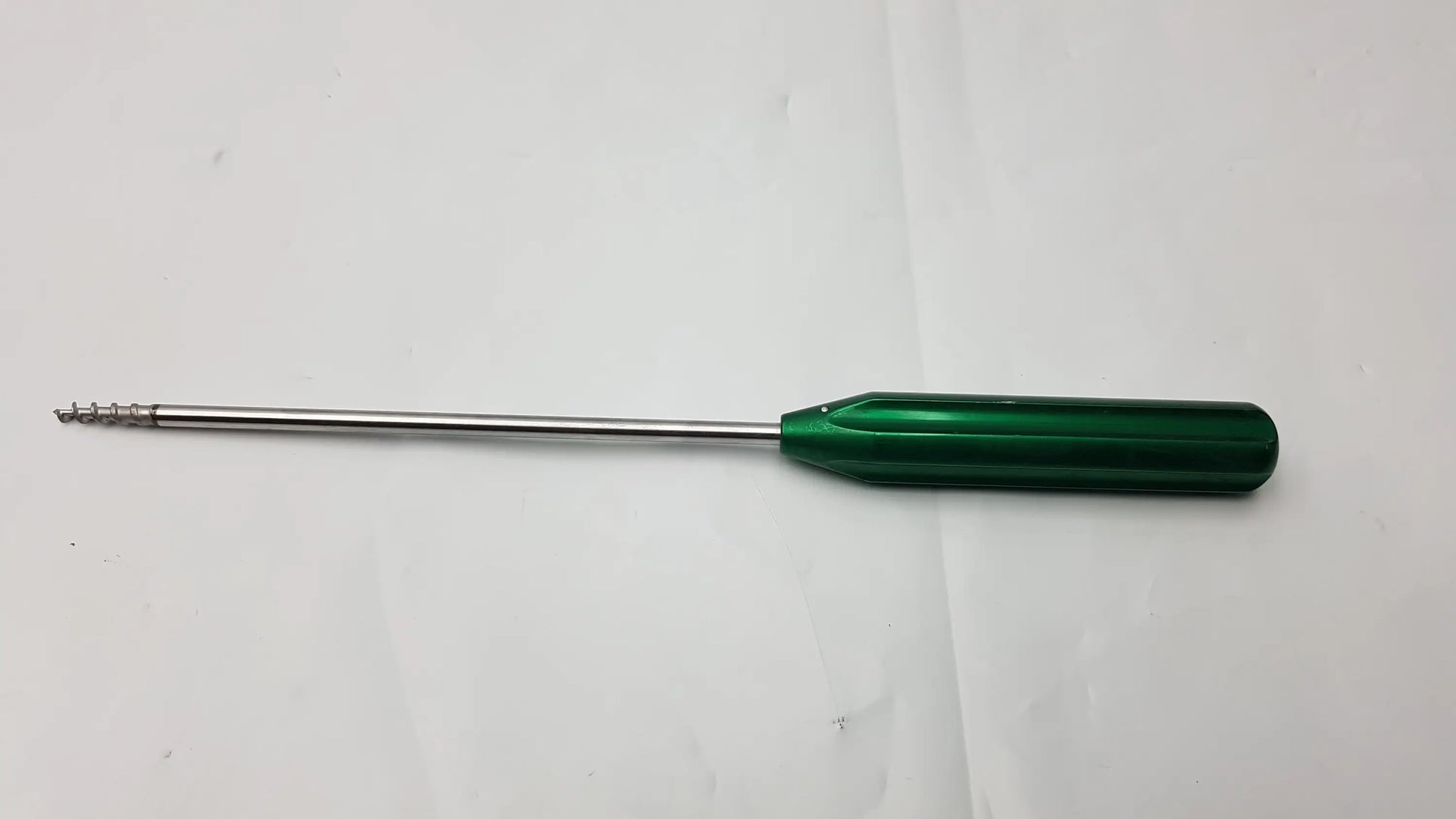 Green-handled arthrex ar-1920tb bio-corkscrew combo punch tap surgical instrument with metallic shaft and threaded tip