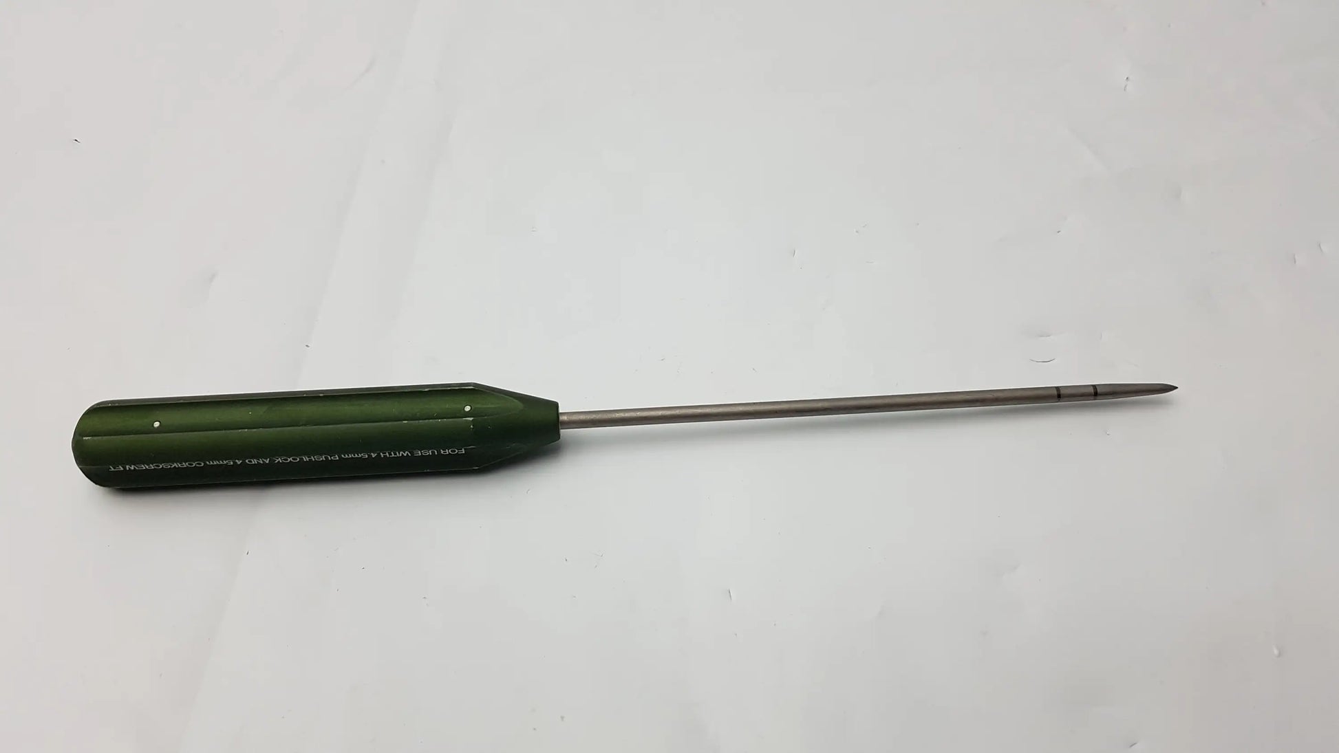 Olive green-handled ar-1922p surgical instrument with metallic shaft designed for corkscrew ft systems use