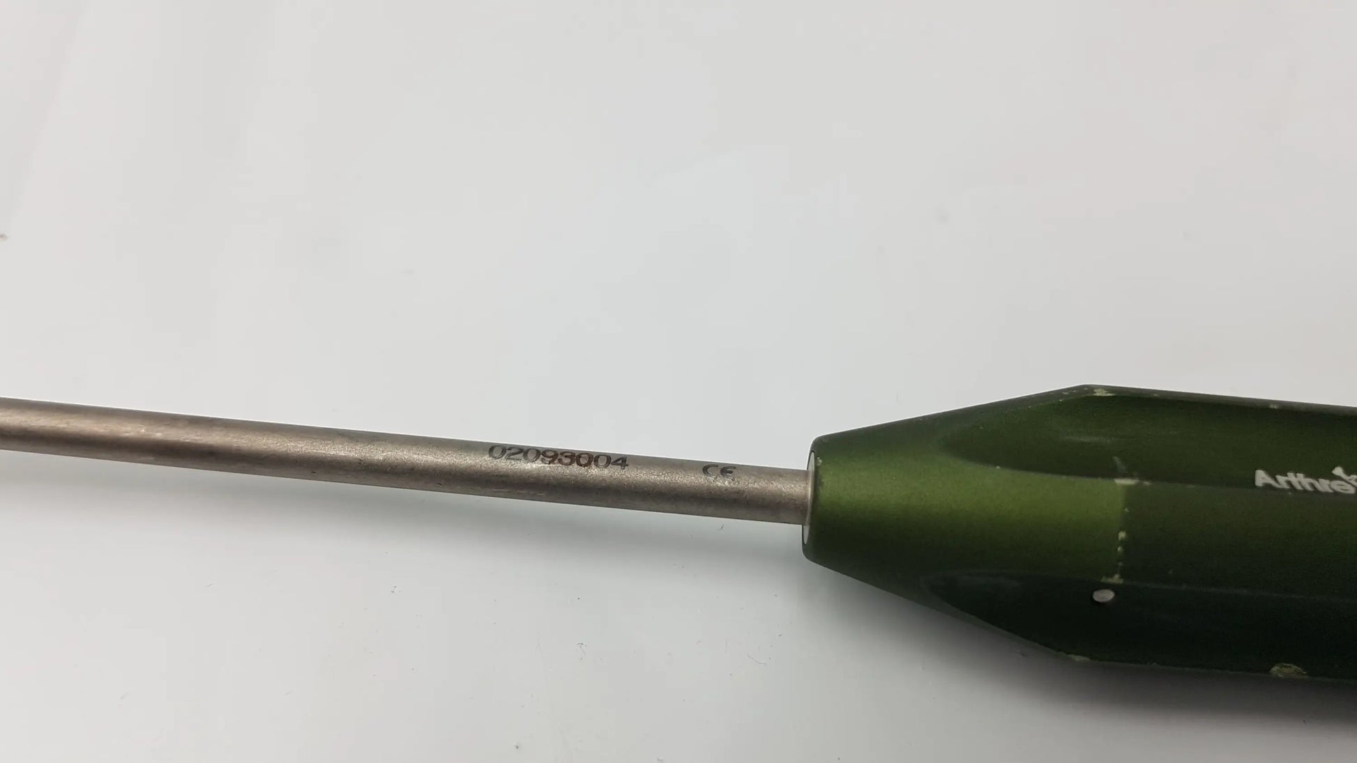 Green-handled arthrex ar-1922p surgical instrument with metallic shaft and engraved serial number for corkscrew ft systems