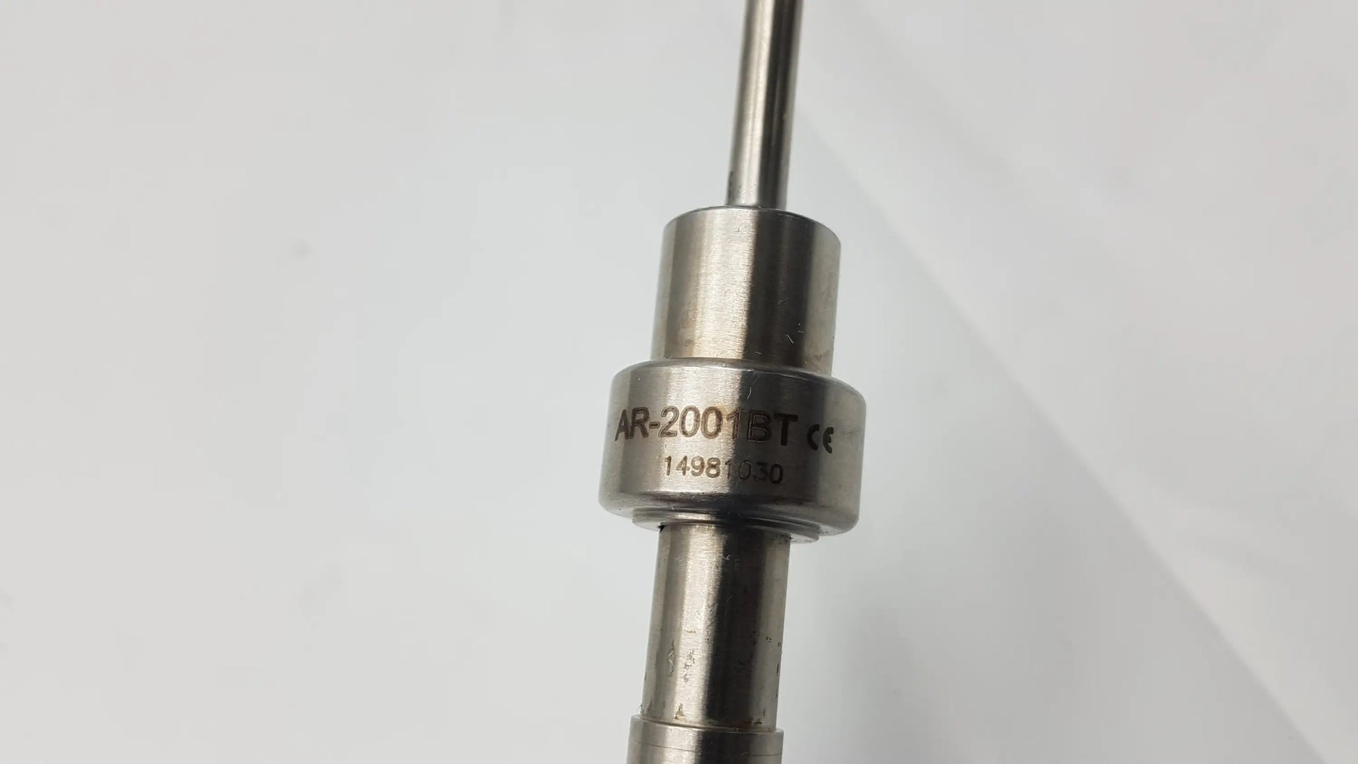 Silver metallic arthrex ar-2001bt tear drop handle fuel injector with engraved model ar-200bt and serial 14981030