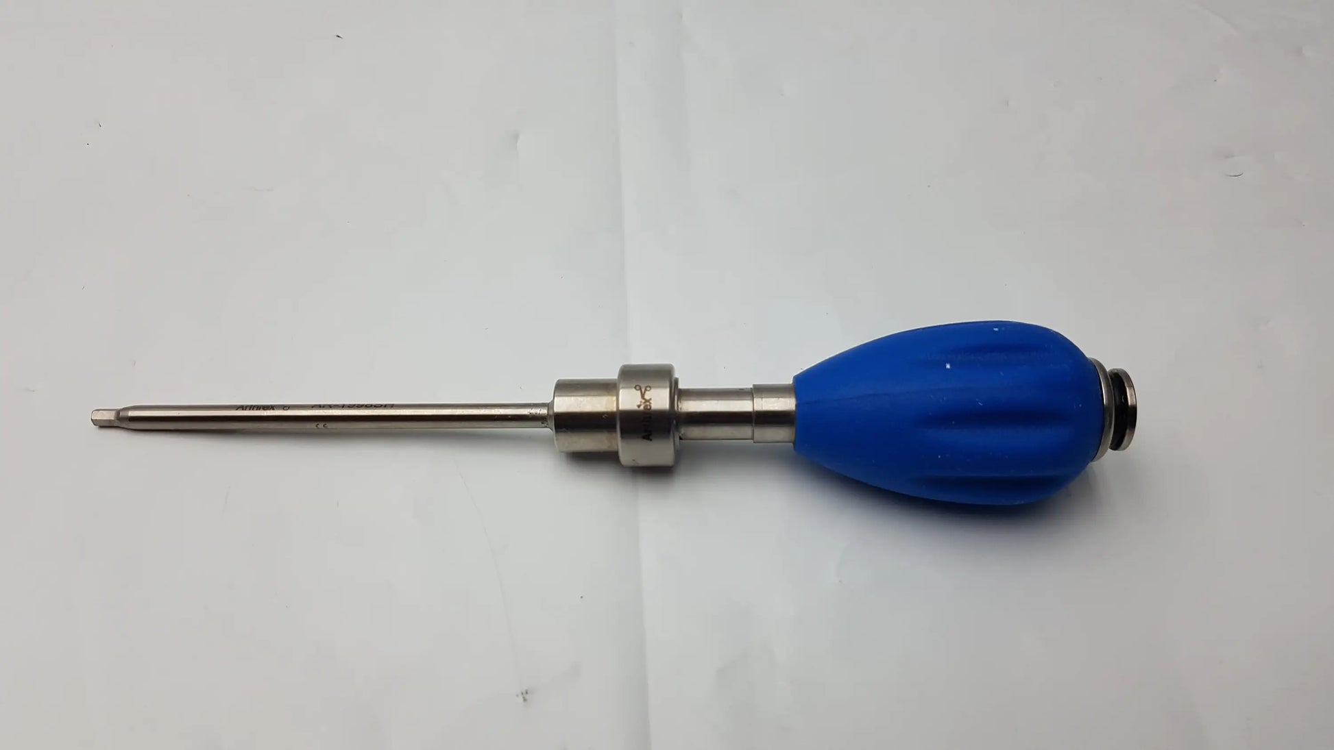 Blue rubber-handled surgical drill bit with metallic shaft featuring arthrex ar 2001bt tear drop handle design