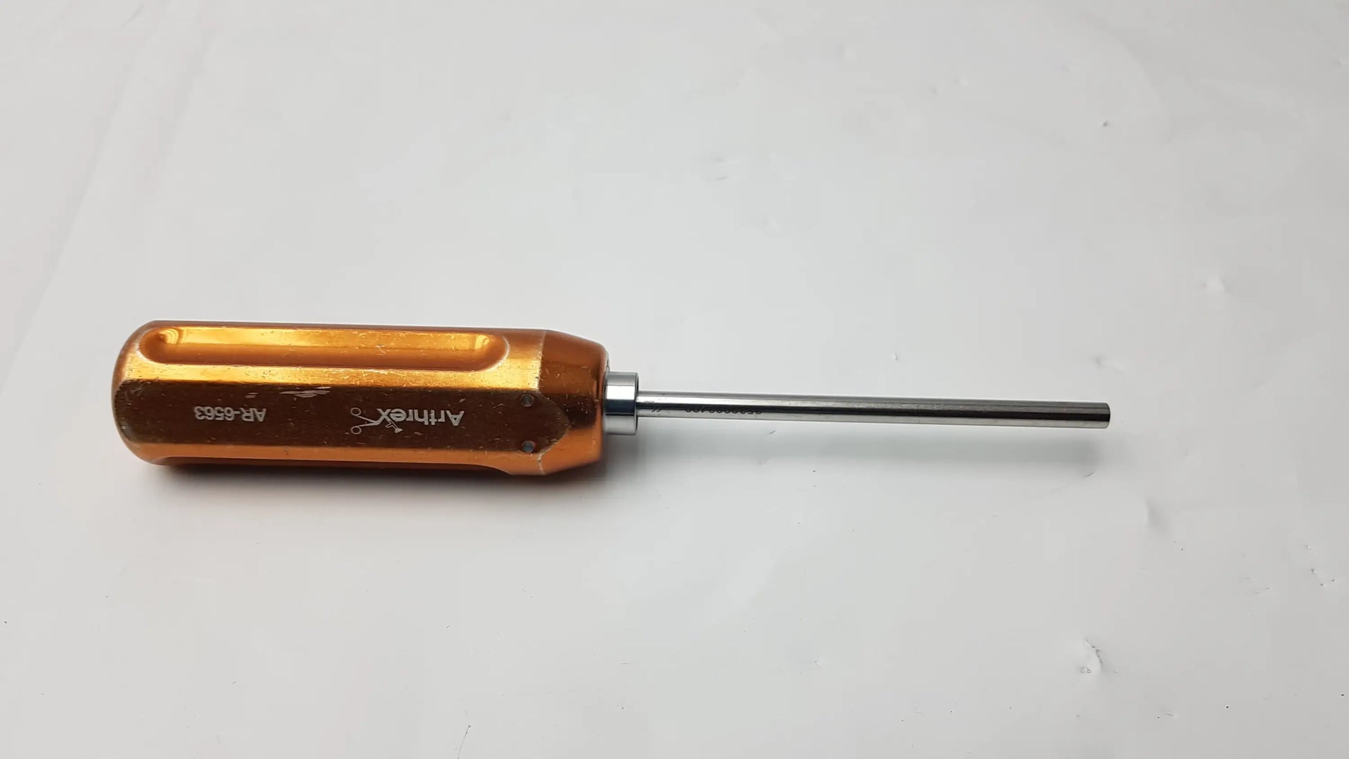 Arthrex AR-6563 reusable obturator surgical instrument with orange aluminum handle and silver metallic shaft with engraving