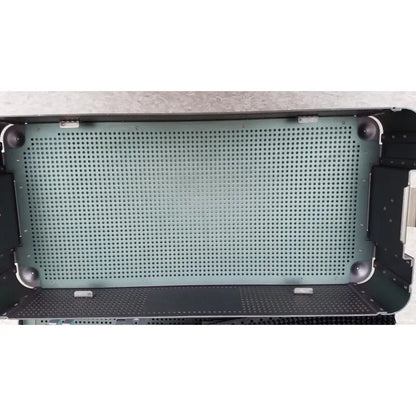 The interior of a black perforated metal sterilization tray with a greenish-gray mesh from the ArthroCare AutoCuff OPUS collection