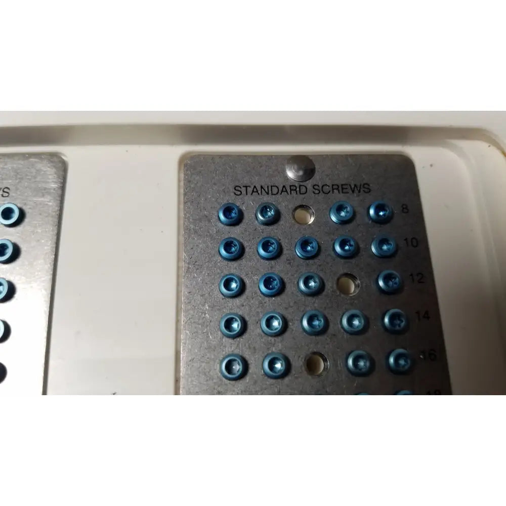 Blue-tipped standard screws on a metallic tray labeled standard screws from ascension forefoot set ref CSA-800-01