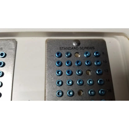 Blue-tipped standard screws on a metallic tray labeled standard screws from ascension forefoot set ref CSA-800-01
