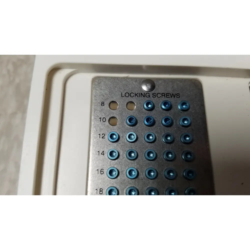Metallic screw tray with blue-tinted locking screws organized by size in the ascension forefoot set ref csa-800-01
