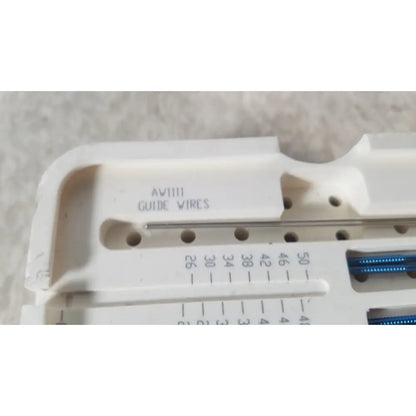 White plastic wire guide with labeled slots and blue insulated wires inside in ascension ref csa-5001-001 capture screws product