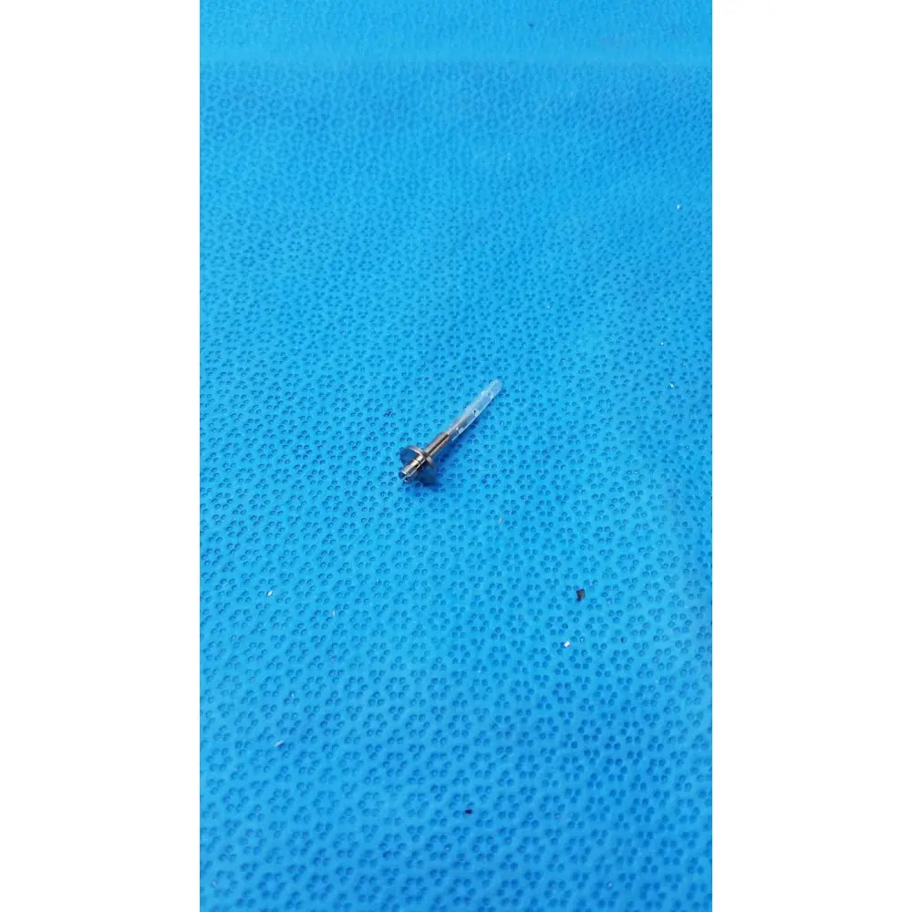A metallic screw with a clear plastic handle used in assembly burr corenal rust ring remover tool