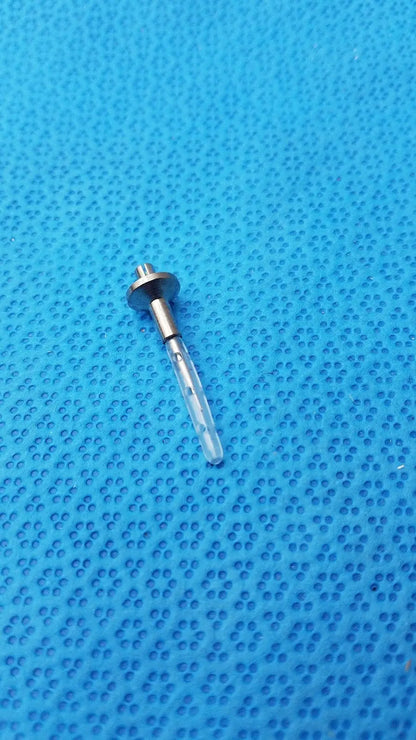 A transparent dental implant screw with metallic threaded head and shaft for assembly burr corenal rust ring removal
