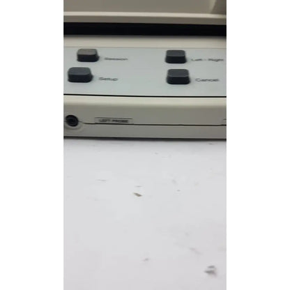 Beige AudioScan Verifit VF-1 hearing aid analyzer with four black labeled buttons and side port for real ear testing