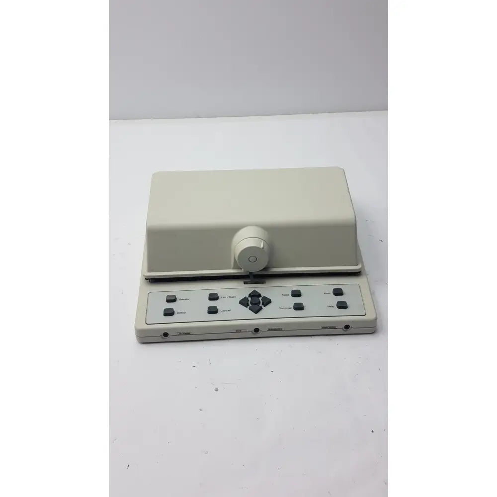 Beige plastic AudioScan Verifit VF-1 real ear hearing aid analyzer with central rotary knob and labeled buttons panel