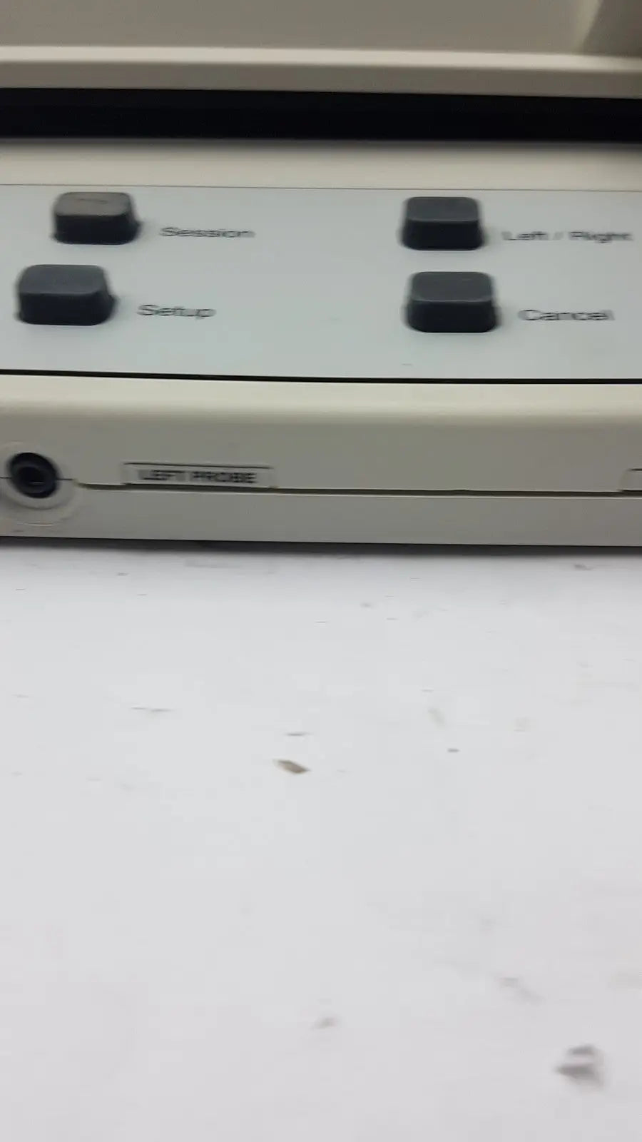 Beige AudioScan Verifit VF-1 hearing aid analyzer with four black labeled buttons and side port for real ear testing