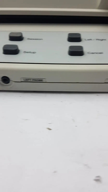 Beige AudioScan Verifit VF-1 hearing aid analyzer with four black labeled buttons and side port for real ear testing