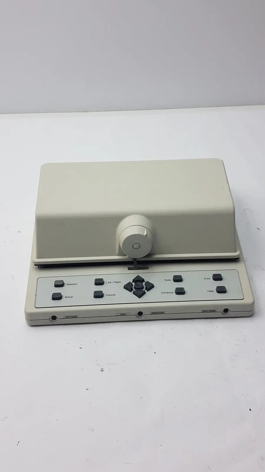 Beige plastic AudioScan Verifit VF-1 real ear hearing aid analyzer with central rotary knob and labeled buttons panel