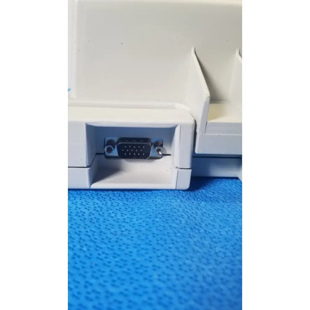 White plastic housing with black vga port on the back of audioscan verifit vf-1 hearing analyzer device