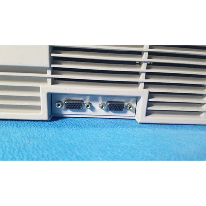 Backside of audioscan verifit vf-1 hearing analyzer showing white plastic vga port panel with silver connectors and screws