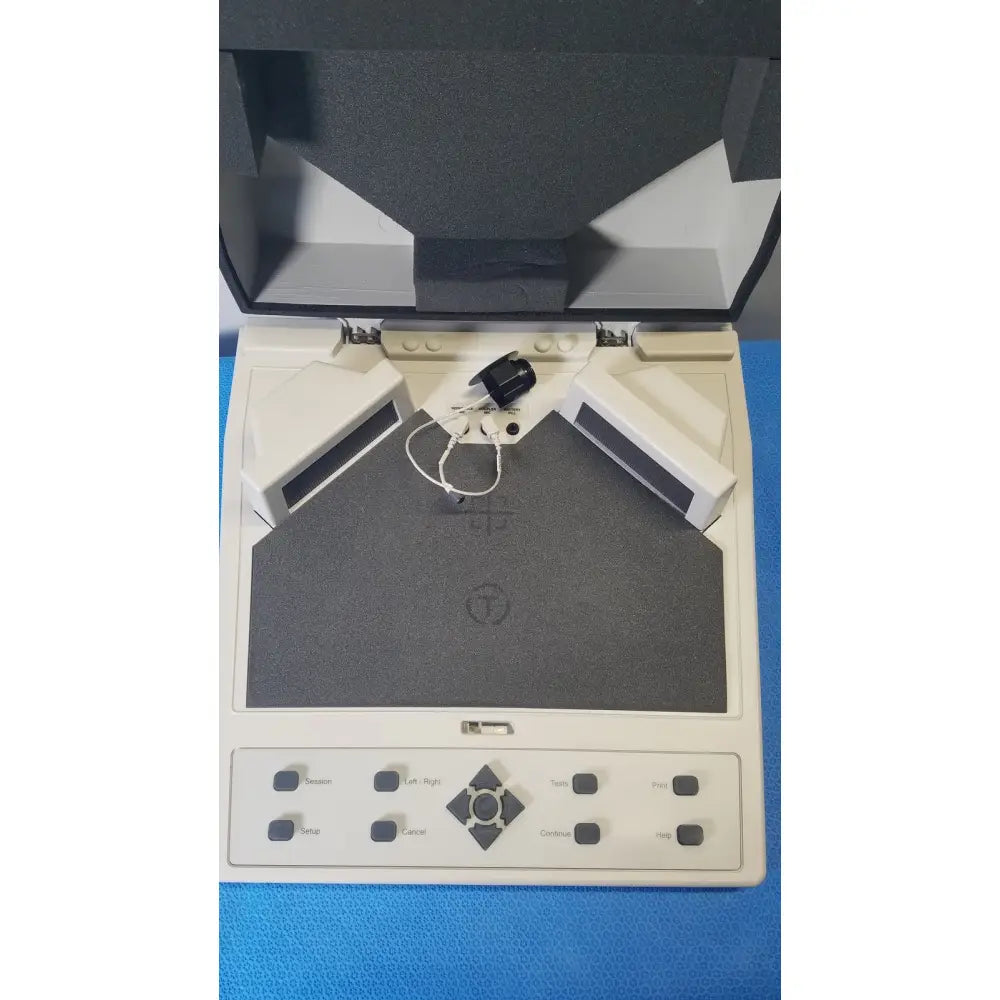 Beige audioscan verifit vf-1 hearing analyzer with gray textured scanning surface and black control buttons for real-ear testing