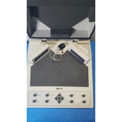 Beige audioscan verifit vf-1 hearing analyzer with gray textured scanning surface and black control buttons for real-ear testing
