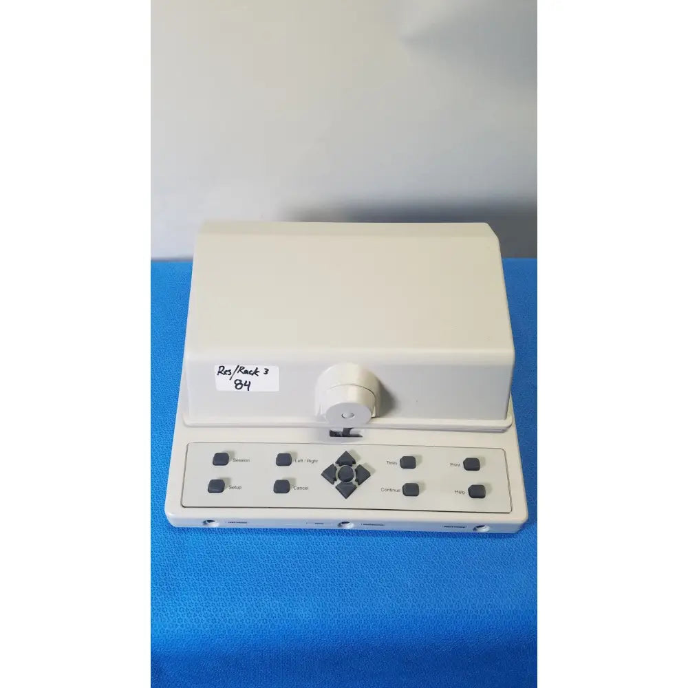 Cream-colored rectangular audioscan verifit vf-1 hearing analyzer with control panel featuring black buttons and directional pad
