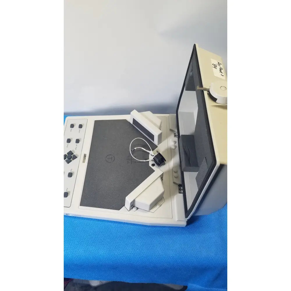 Beige and black audioscan verifit vf-1 hearing analyzer with flatbed platform control panel and angled viewing screen