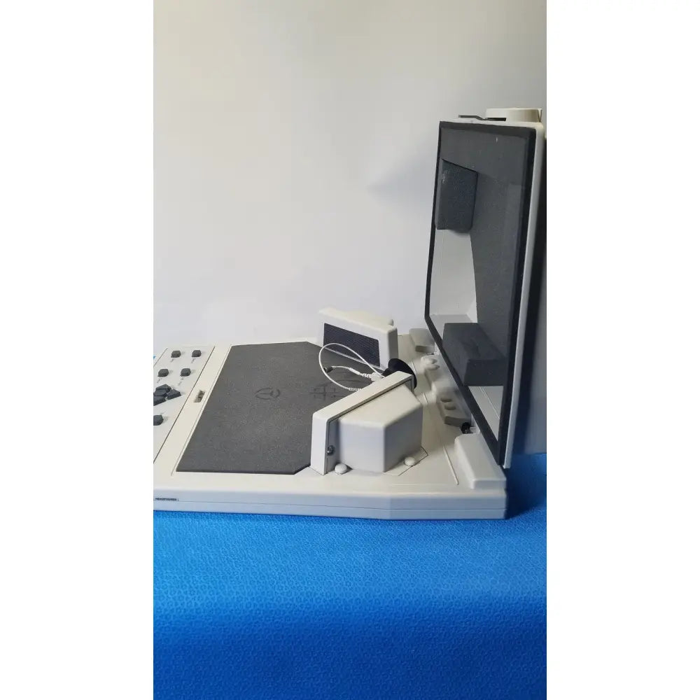 White plastic audioscan verifit vf-1 hearing analyzer with hinged screen and control panel for real-ear testing