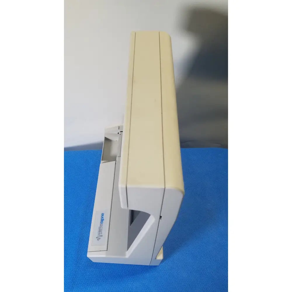 Beige plastic desktop audioscan verifit vf-1 hearing analyzer with sleek rectangular design and visible paper tray
